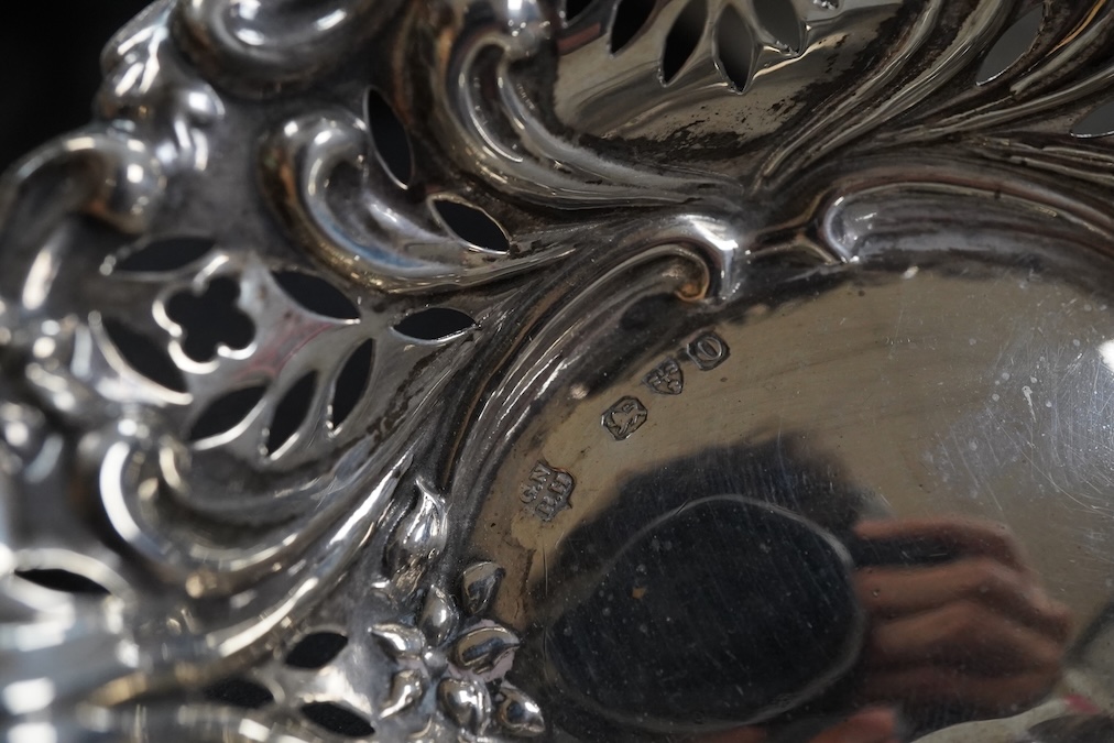 A collection of mixed silver to include a mustard pot, pierced dish etc.